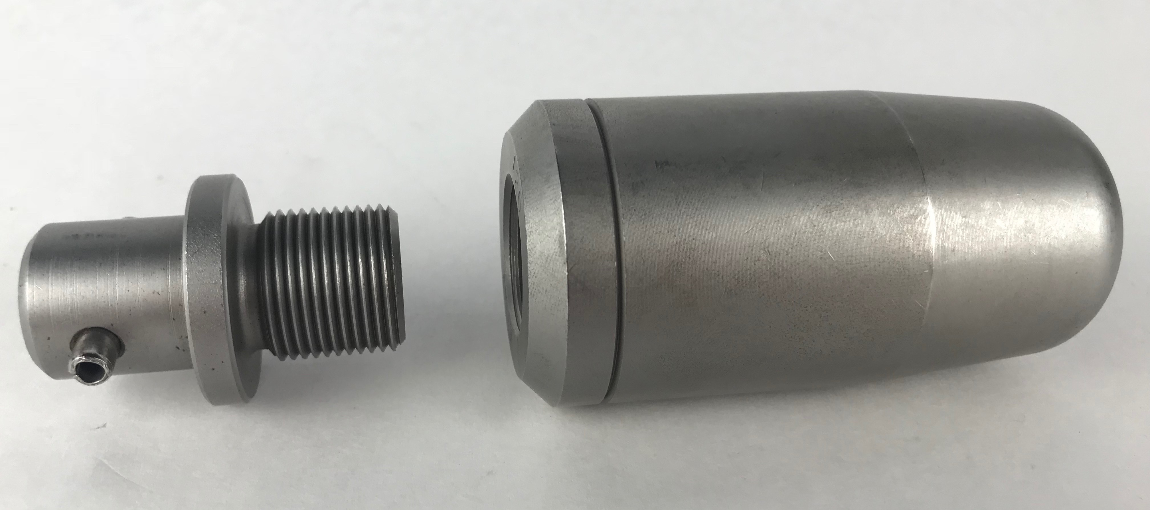 The Huth Swage die in a silver-colored steel finish is shown with a PKDS-823 adapter for connecting the BendPak®️ machines with the Huth Swage end-forming tooling. 